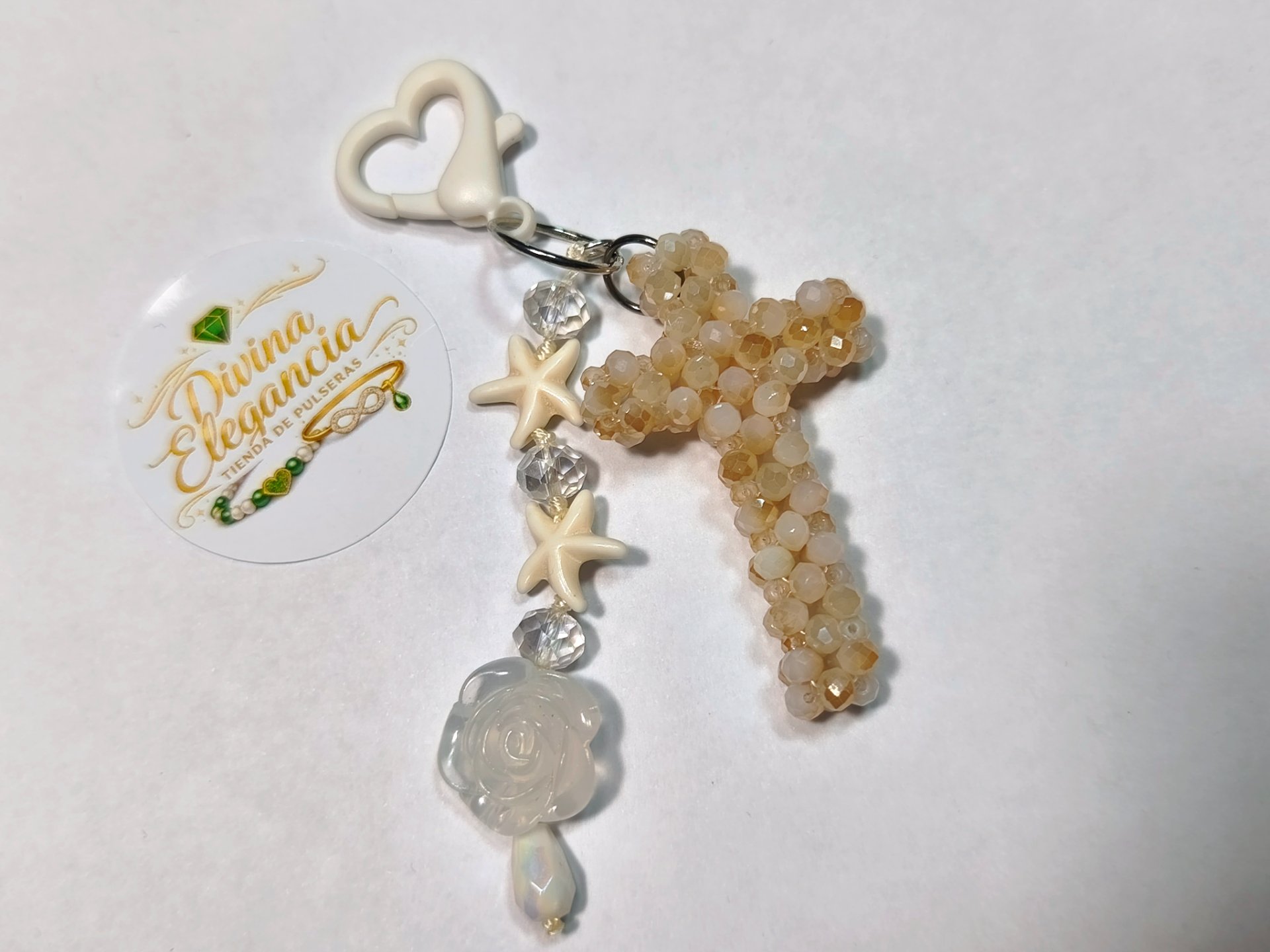 Llavero cruz beige