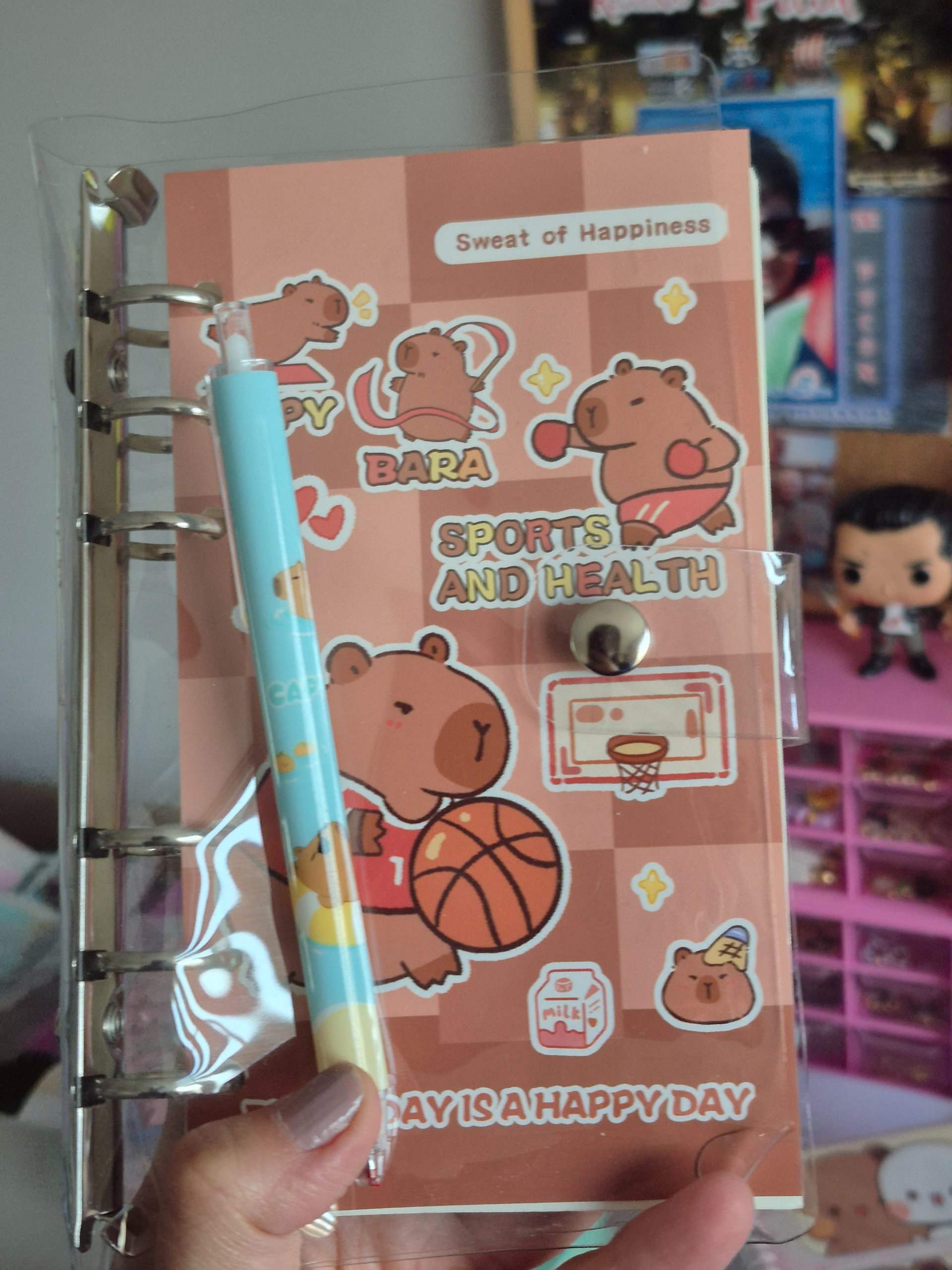 Libreta binder más lápiz capybara