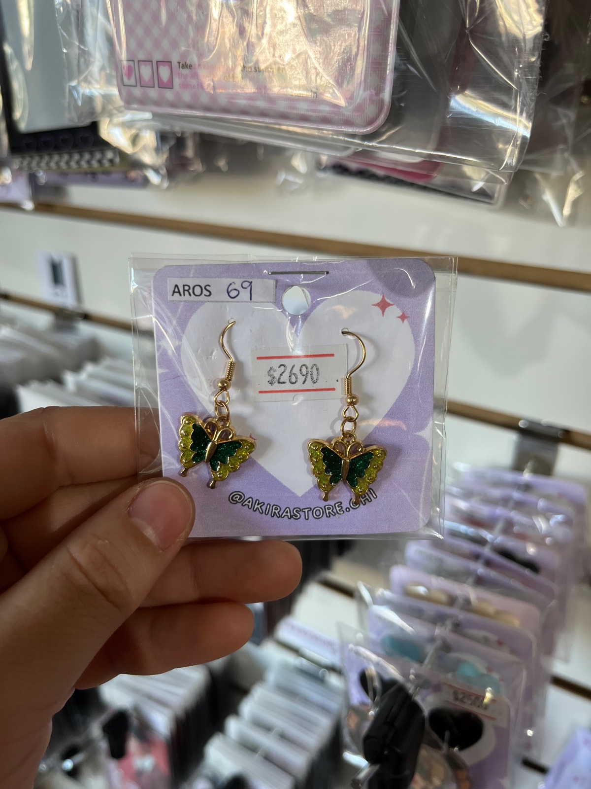 aros mariposa verde con dorado